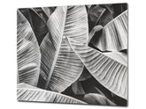 Tempered GLASS Cutting Board – Worktop saver and Pastry Board –- Glass Kitchen Board; MEASURES: SINGLE: 60 x 52 cm (23,62” x 20,47”); DOUBLE: 30 x 52 cm (11,81” x 20,47”); D34 Nature Series: Black and white banana leaves