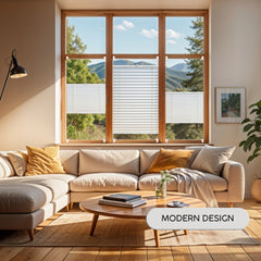 Modern living room with a sectional sofa, coffee table, and large window view of trees and mountains, with the pleated blinds installed on the windows.