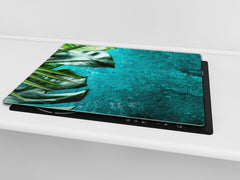 Induction Cooktop Cover Kitchen Board – Impact Resistant Glass Pastry Board – Heat resistant; MEASURES: SINGLE: 60 x 52 cm (23,62” x 20,47”); DOUBLE: 30 x 52 cm (11,81” x 20,47”); D31 Tropical Leaves Series: Tropical leaves background