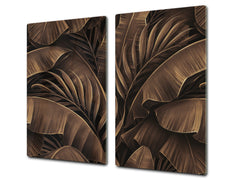 Induction Cooktop Cover Kitchen Board – Impact Resistant Glass Pastry Board – Heat resistant; MEASURES: SINGLE: 60 x 52 cm (23,62” x 20,47”); DOUBLE: 30 x 52 cm (11,81” x 20,47”); D31 Tropical Leaves Series: Bronze banana leaves