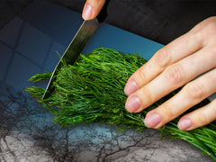 Worktop saver and Pastry Board – Cooktop saver; Series: Outside Series DD19 A woman in the branches of trees