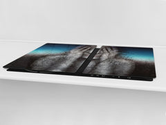 Worktop saver and Pastry Board – Cooktop saver; Series: Outside Series DD19 A woman in the branches of trees