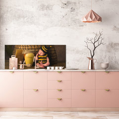 Wide-format tempered glass kitchen wall panel with metal backing - and without: Sleepy baby in bee outfit