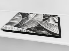 Tempered GLASS Cutting Board – Worktop saver and Pastry Board –- Glass Kitchen Board; MEASURES: SINGLE: 60 x 52 cm (23,62” x 20,47”); DOUBLE: 30 x 52 cm (11,81” x 20,47”); D34 Nature Series: Black and white banana leaves