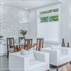 Pleated blind installed on window showing stepless up-down adjustment, semi-opaque fabric filtering natural light while maintaining privacy.