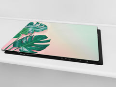 Induction Cooktop Cover Kitchen Board – Impact Resistant Glass Pastry Board – Heat resistant; MEASURES: SINGLE: 60 x 52 cm (23,62” x 20,47”); DOUBLE: 30 x 52 cm (11,81” x 20,47”); D31 Tropical Leaves Series: Monstera on pink background