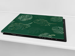 Induction Cooktop Cover Kitchen Board – Impact Resistant Glass Pastry Board – Heat resistant; MEASURES: SINGLE: 60 x 52 cm (23,62” x 20,47”); DOUBLE: 30 x 52 cm (11,81” x 20,47”); D31 Tropical Leaves Series: Modern monstera leaves