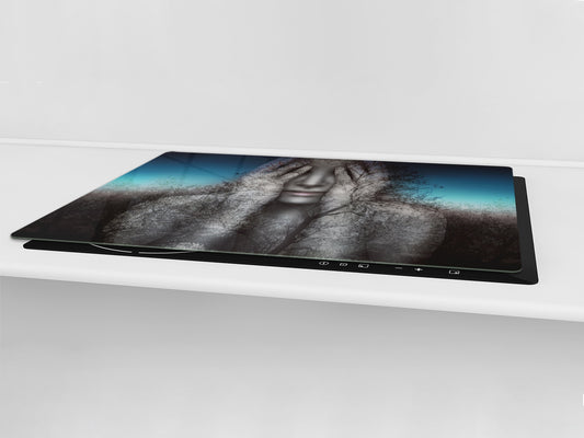 Worktop saver and Pastry Board – Cooktop saver; Series: Outside Series DD19 A woman in the branches of trees