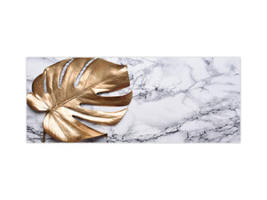Stunning glass wall art - Wide format kitchen backsplash with and without metal back-coating - Tropical Leaves Series: Golden leaf on marble