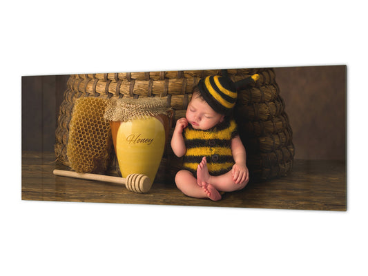 Wide-format tempered glass kitchen wall panel with metal backing - and without: Sleepy  baby in bee outfit