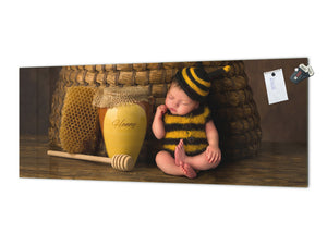 Wide-format tempered glass kitchen wall panel with metal backing - and without: Sleepy  baby in bee outfit