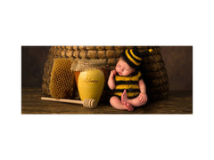 Wide-format tempered glass kitchen wall panel with metal backing - and without: Sleepy  baby in bee outfit